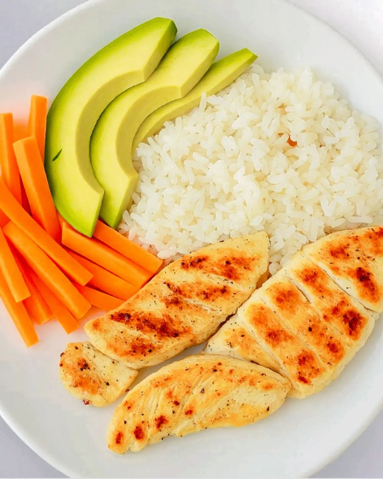 A Healthy & Delicious Bowl: Grilled Chicken, Avocado, Carrot, and Rice